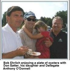 Bob Ehrlick enjoying a plate of oysters with Don Statter, his daughter, and
      Delegate Anthony O'Donnell.
